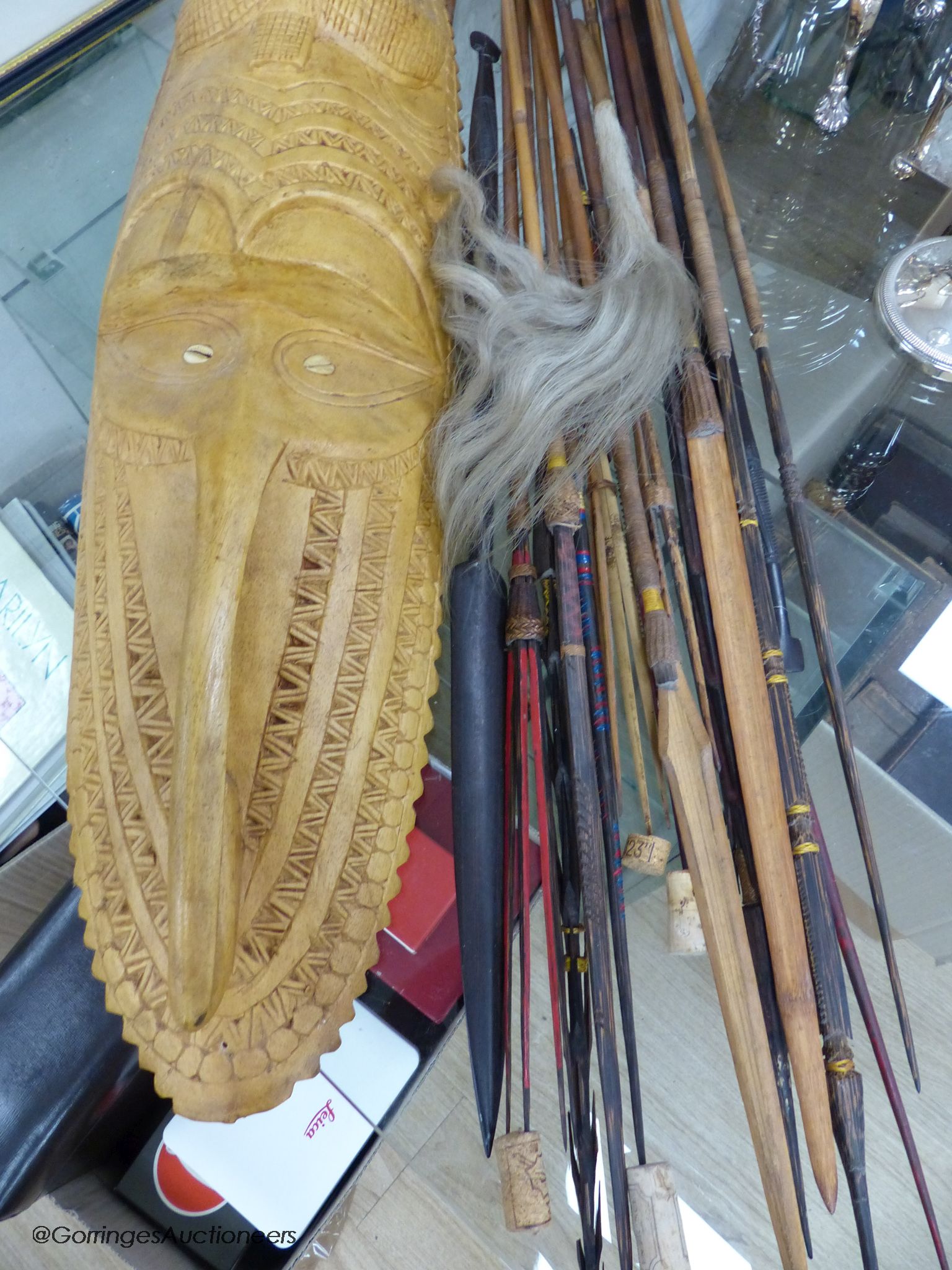 A collection of Tribal style spears etc and a mask